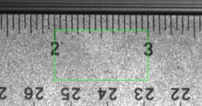 The actual size of the ROI can be calibrated in millimeters. The ROI size is displayed at the bottom of the image on the left. The actual size in millimeters depends on the stand-off distance.