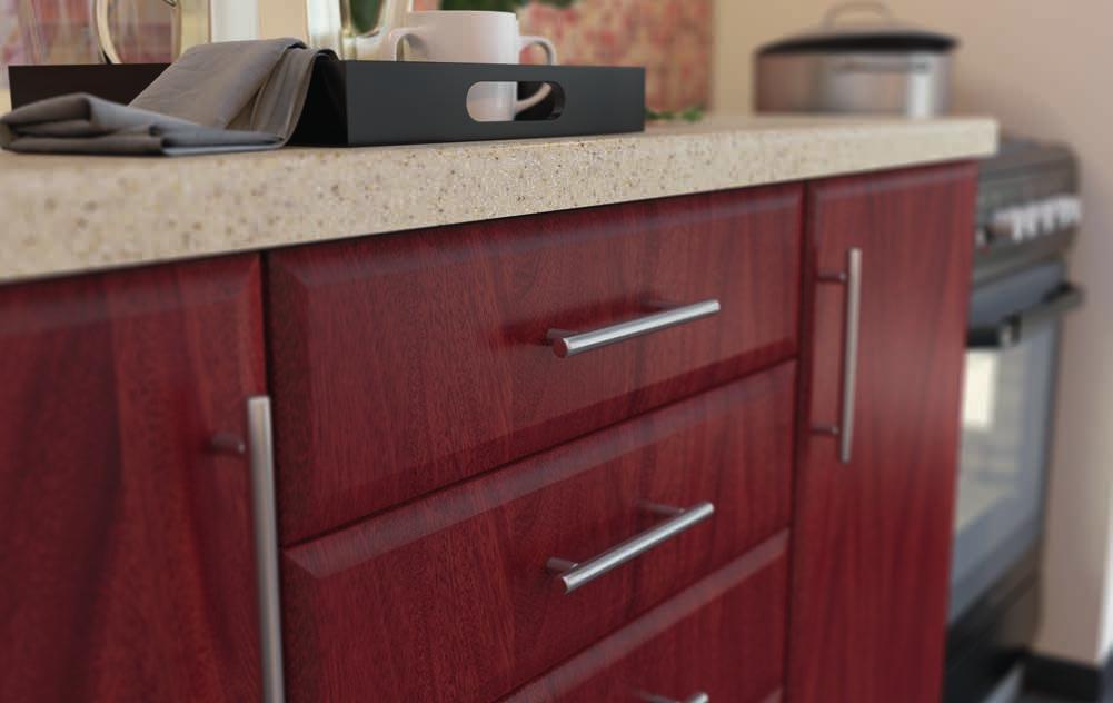 These mahogany color cabinets look luminous when paired with light color granite for counter-tops.