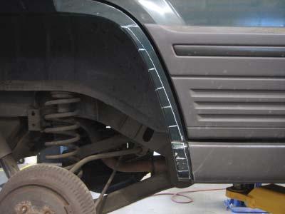 Hold factory side cladding to dog leg are of wheel well and trace a line at the top of the cladding on the vehicle.
