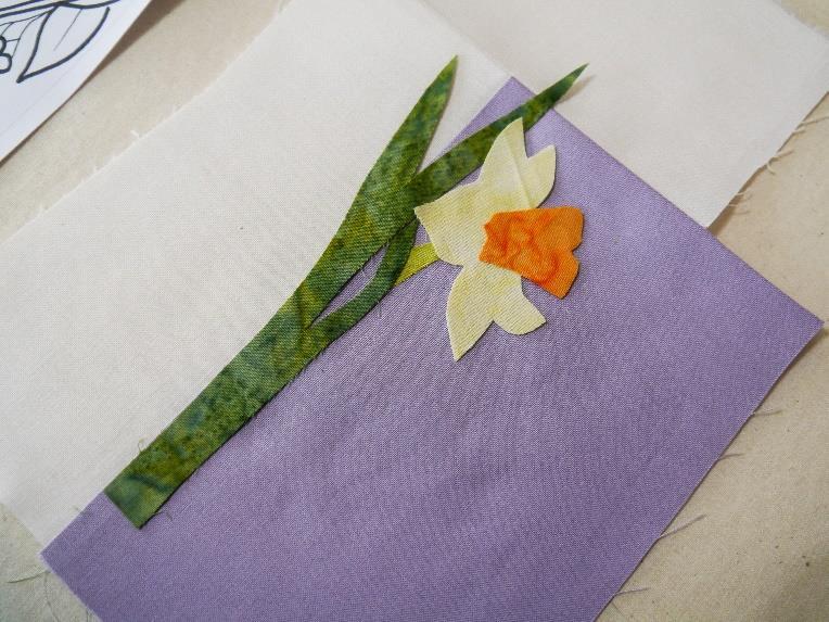 If you have purchase the kit, then I have included enough fabric to either make either size embroidery. Trace out the design of the daffodils, bluebells and Goldcrest with freezer paper.
