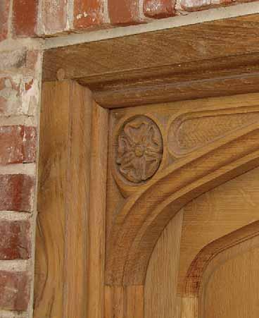 A carved Tudor head panelled door,