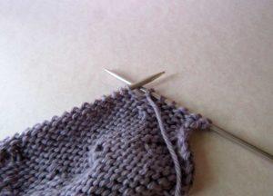 If a knit side is facing you, slip the turning stitch