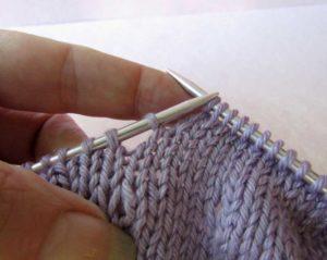 pick up the strand of yarn below the