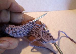 Step 4: Pull the yarn to the back of the work OVER