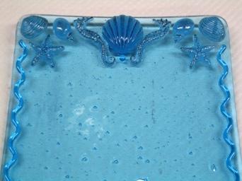 Follow the above instructions to create a rectangular panel from thin, tropical blue, iridized glass and