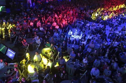 People attend the Electronic Arts brief during the Electronic Entertainment Expo at the Shrine Auditorium in Los Angeles, Monday, June 15, 2015.