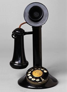 1950s Rotary dial telephones are in use.