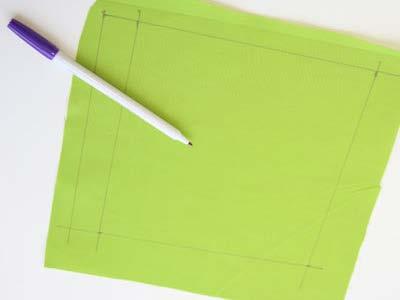 To create the front of the first page, draw a 7 1/2" x 7 1/2" square on the fabric with an air erase marker.