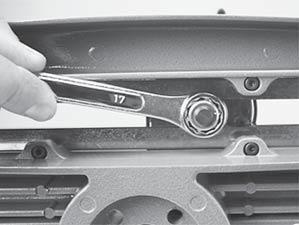 If the string slips through the jaws of the clamp, tighten the clamp by compressing the clamp jaws together by hand while turning the Adjustment Knob, in the clockwise direction.
