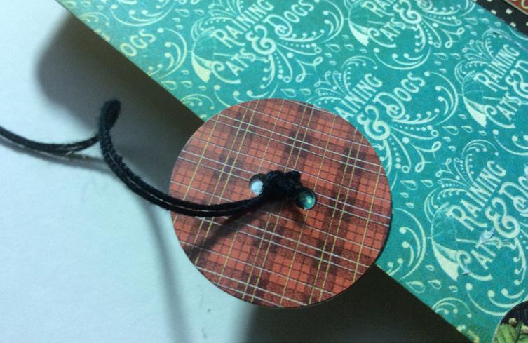 Create button & string closure: place polka dot button sticker on the front edge of flap