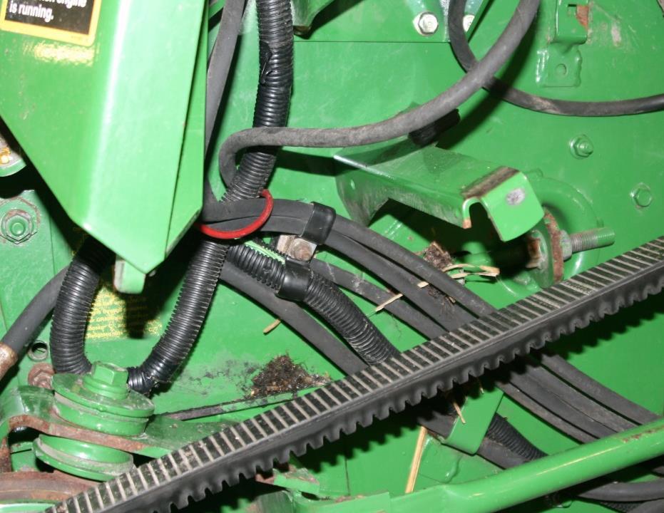 Remove and discard hose clamp (D) retaining reel lift hose and reel retract hose. See Figure 4.