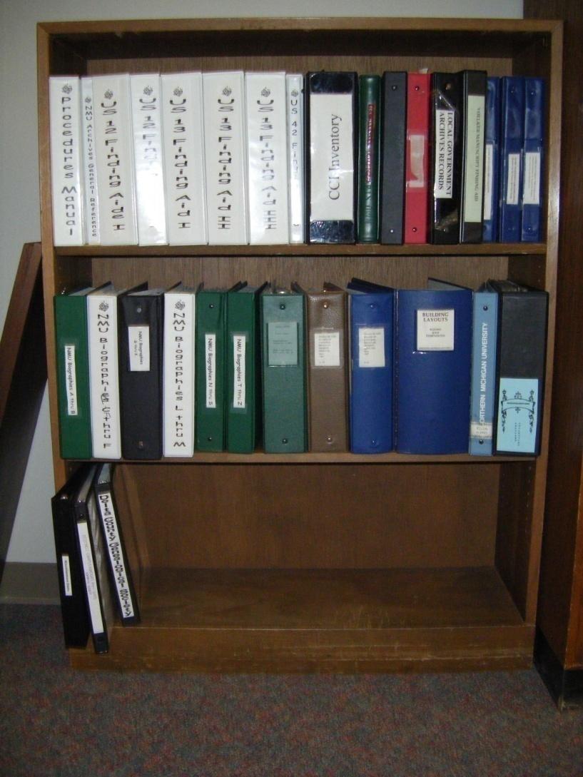 Our general reference shelf contains finding aides for specific collections, such as the John D.