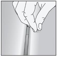 Using your thumb, lightly push the displaced decking material over the hole