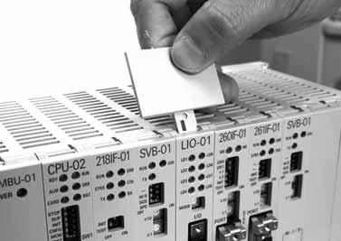Then, remove the Machine Controller and Expansion ack from the panel or rack, and place them where there is sufficient space, such as on a work table. ( 2 ) emoving the I/O Module 1.
