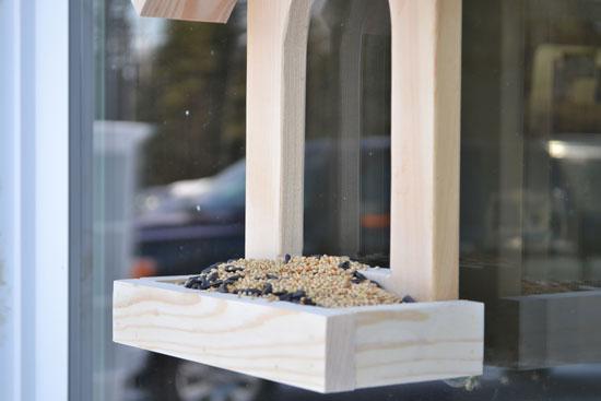 We had some scrap 1x8 boards in pretty terrible condition, and of course, quite a few 1x2 and 1x3 scraps. So we were able to build this little birdfeeder for free!