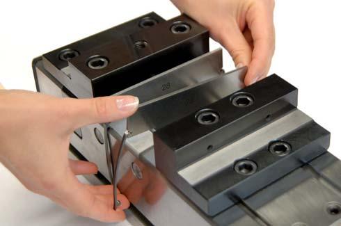 Insert the Cliparc clamps into the rails and snap them into the vice. No tools necessary.