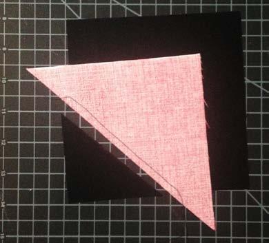 Place one triangle right sides together with one square as shown.
