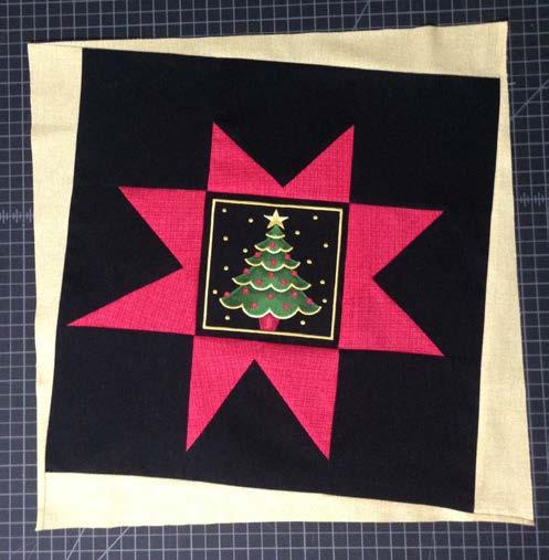 Use the same method to sew the remaining triangles to the remaining star blocks, matching the red triangles with the yellow star block and the yellow triangles with the red star block.