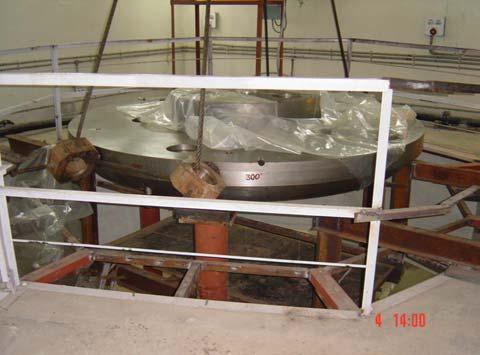 Figure 2: Main magnet pole base mounted on the pier support in the cyclotron building. Figure 4: Superconducting coil winding in progress Figure 3: Pole tips installed on the pole base.