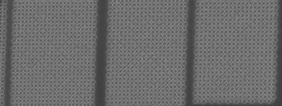 Pseudo phase shift mode print using same mask as used in Fig. 2, now yielding 27, 26, and 25 nm square grid contacts. Figure 6. Pseudo phase shift mode print of 20, 19 and 18 nm dense contacts. 728 4.