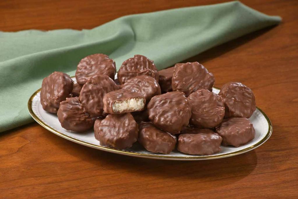 50 5669 FROG FUDGIES Diseño de Una Rana de Chocolate Cremoso Whimsically sculpted frogs are filled with cool mint fudge. 6 oz. box. $11.