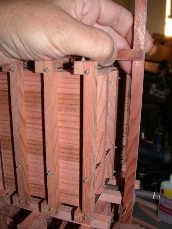 Glue the Top Braces to the Vertical Beams using the scribed lines as a guide,