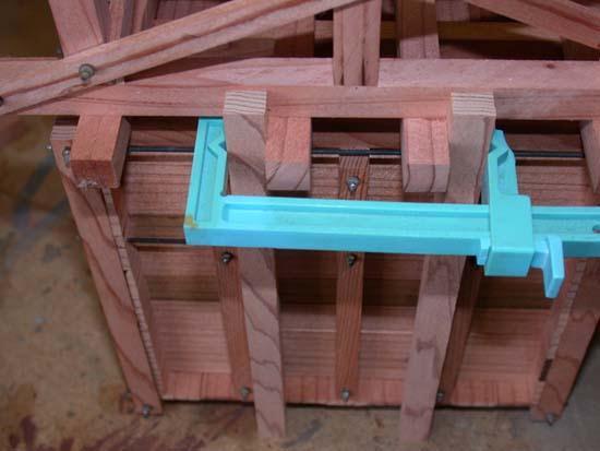 Lay a 6 x 8 along the clamped uprights, with its edge butted