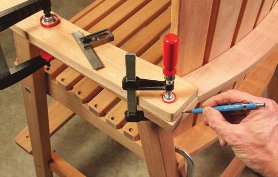 Set the clamped-up back slat assemblies into position on the chair seats.