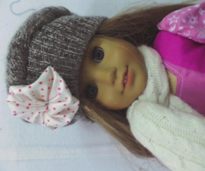 Now McKenna is stylish and warm! I think I will write down the instructions so other kids can make some warm winter things for their dolls, too!