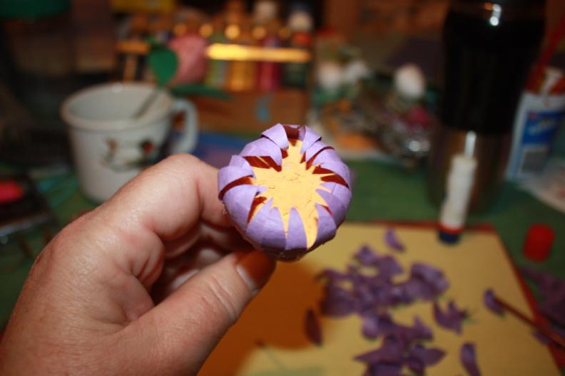 Glue a row of small petals along the