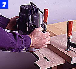 Lay out the rounded profile at each end of the top rail and use the sabre saw to make the cut. Cut a No. 0 joining plate slot in each end of the rail, and a matching slot in each case side.