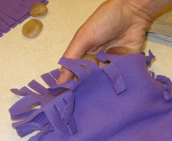 (OPTION TWO WITH FABRIC) Supplies: Fleece fabric cut into twice as many squares as your zip lock baggies.