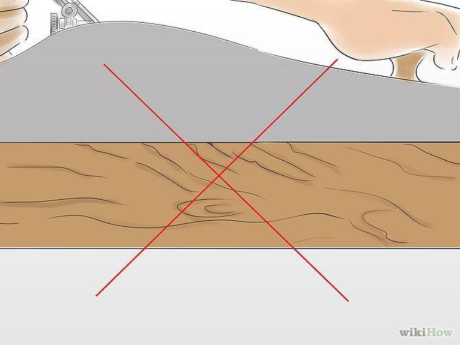 5 Avoid tear-out by cutting along the grain of the wood. To smooth the surface of the board, you may find that you need to plane in multiple directions.
