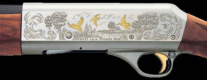 On the left hand receiver of the 20-gauge Fenice, lineengraved scrollwork accents a flight of gold embellished snipe rising above a flooded field.