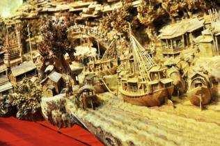 The carving is based on the famous Chinese painting Along the River During the Qingming Festival. The original artwork was created over 1,000 years ago.