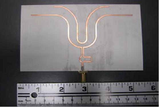 Figure 16. antenna. A photograph of the prototype quasi-landstorfer a reflector portion with metallization on two layers. The top layer consists of the feeding part and the driven part.