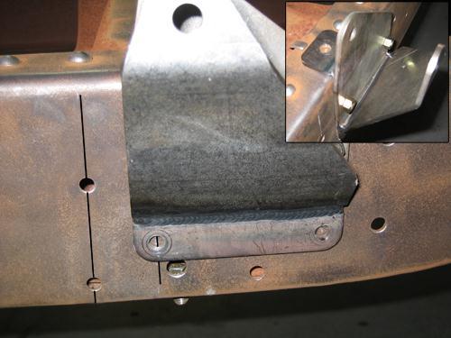 This will keep the bracket from moving as you drill the remaining hole. After the top two holes are drilled, remove the bracket from the frame rail.