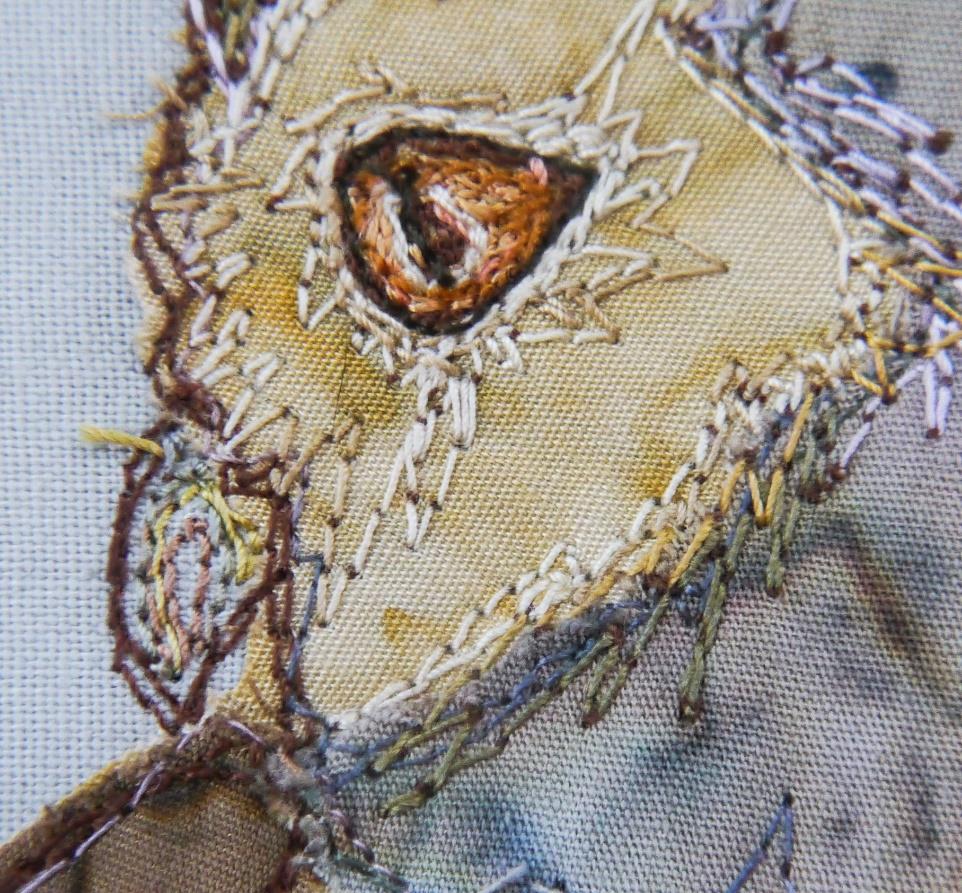 Once you are happy with the position change to a variegated cream thread and add some stitching around the eye.