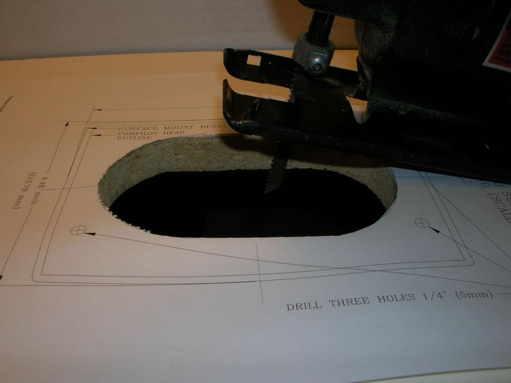 3) Mark the mounting surface, in the desired location, with the main oval cut-out, and the locations of the three mounting
