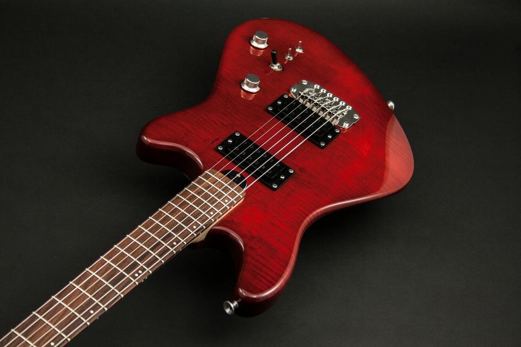 Noticeably Finer Musical Instruments Huge is the only word to describe the Fireball baritone guitar sound. Tuned 1/5th below standard guitar tuning (A-D-G-C-E-A), and an extra long 29.