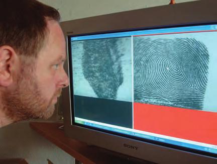 A technician compares fingerprints in the AFIS system. There are about 0 recorded cases of permanent, intentional fingerprint mutilations.