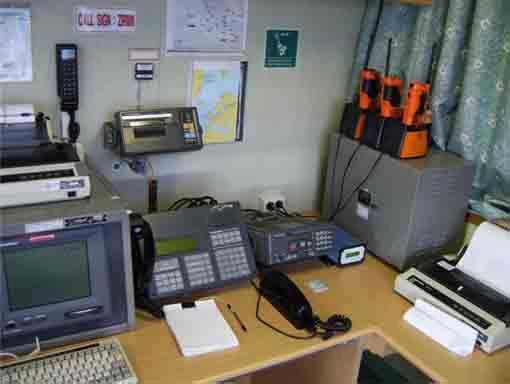 These batteries can be seen stored in the charger units alongside the radios Maritime-12 FIGURE 13