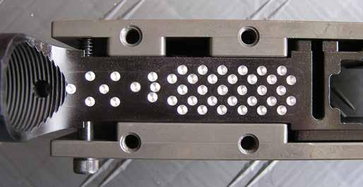 Removing Excess Material With Jig Drilling Adapter Plate This first step involves drilling shallow guide holes approximately 1/16 deep using the jig drilling adapter plate with a 1/8 drill bit.