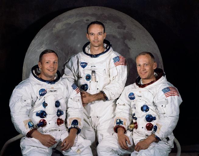 Yuri Gagarin Neil Armstrong, Michael Collins & Buzz Aldrin In 1961, a Russian called Yuri Gagarin was the first man to go into space and orbit the Earth, but the American crew of Apollo 8 were the