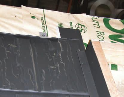 row of shingles below the skylight and over the end wall flashing.