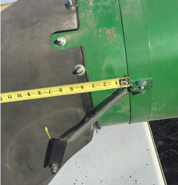 Installation Refer to Figures 2.5 & 2.6 6. The drilled hole should line up with the nut welded to the grain saver door.