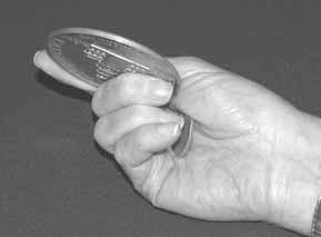grip closer to the center of the coin as shown in Photo 6. Be sure the right hand s knuckles are perpendicular to the floor.