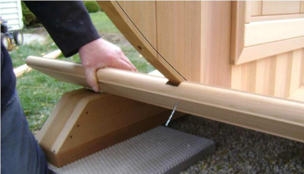 Here the installer is using one of the supplied 2½ finishing nails to hold a stave onto the bottom part of the