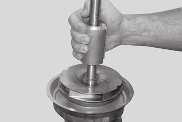 47 or 47c) and (Pos. 47d or 47e) onto the chamber. Position the reduced diameter end of the punch through the components. Use a rubber mallet to drive in place.