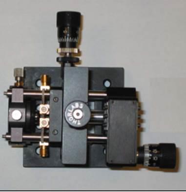 Timing is controlled through a mechanical delay line that consists of a retro-reflector on a stepper motor driven translation stage Both the transmitter and receiver chips are housed in a module